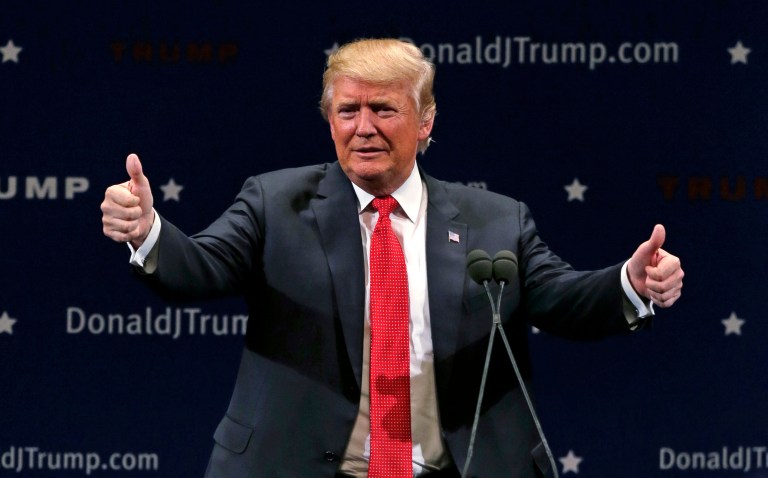 Republican presidential candidate Donald Trump defied pundits again in a new national poll that shows him gaining even more momentum just weeks before the Iowa caucus. (AP Photo/Charles Krupa)