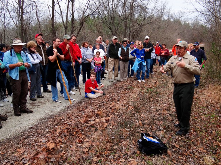   This Jan. 1, 2012 photo provided by the Virginia State Parks and the Department of Conservation and Recreation shows Virginia State Parks ranger Bob Flippen, right, at Virginiaâs High Bridge Trail State Park leading a group of hikers on a First Day Hike in Va. The hike was one of 400 First Day Hikes held at state parks last Jan. 1. More than 600 are planned for this Jan. 1. (AP Photo/Virginia Department of Conservation and Recreation)  