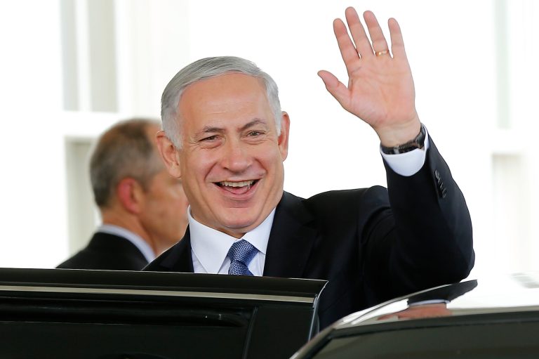 Israeli Prime Minister Benjamin Netanyahu waves as he leaves the west wing of the White House following a meeting on Oct. 1, 2014, in Washington. (Photo by Win McNamee/Getty Images File)