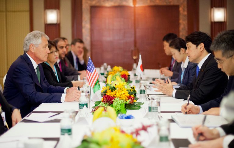 U.S. Defense Secretary Chuck Hagel, left, listens to Japanese Defense Minister Itsunori Onodera, right, at the start of their meeting Saturday, May 31, 2014 in Singapore. Hagel traveled to Singapore to attend the 13th Asia Security Summit. (AP Photo/Pablo Martinez Monsivais, Pool)
