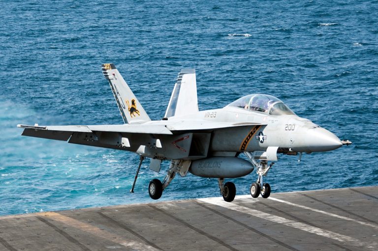In this image provided by the U.S. Navy a F/A-18F Super Hornet attached to the Fighting Black Lions of Strike Fighter Squadron lands aboard the aircraft carrier USS George H.W. Bush in the Persian Gulf on Tuesday, Sept. 23, 2014, after conducting strike missions against Islamic State group targets in Syria. (AP Photo/U.S. Navy, Mass Communication Specialist 3rd Class Brian Stephens)