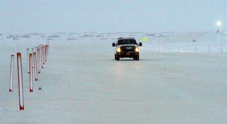 A truck drives on an ice bridge constructed near the Colville-Delta 5, or as it's more commonly known, CD5, drilling site on Alaska's North Slope. ConocoPhillips in October 2015 became the first to drill for oil in the National Petroleum Reserve-Alaska, a region the size of Indiana. (AP Photo/Mark Thiessen)