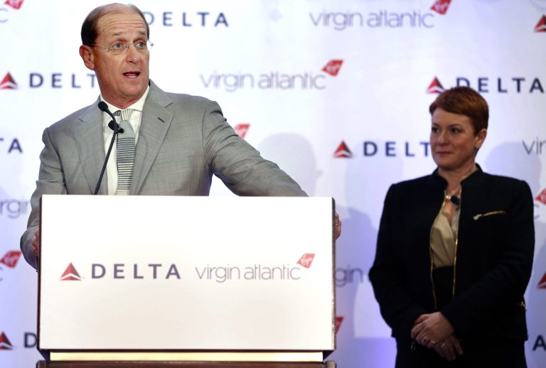   Delta Airlines CEO Richard Anderson speaks while Virgin Atlantic CCO Julie Southern listens during a news conference in New York, Tuesday, Dec. 11, 2012. Delta Air Lines said it will buy almost half of Virgin Atlantic for $360 million as it tries to catch up to rivals in the lucrative New York-to-London travel market. (AP Photo/Seth Wenig)  