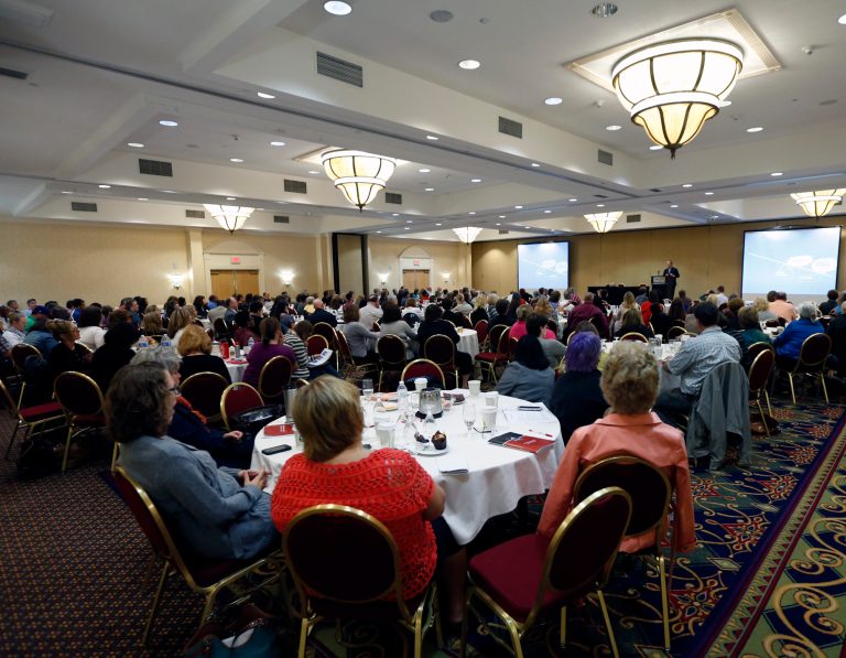 Attendees listen as Dr. Jon Grant talks about gambling and other addictive disorders during the New York Council on Problem Gambling's annual conference on Thursday, Oct. 2, 2014, in Albany, N.Y. New York has slashed funding for gambling addiction in half in the past four years even as it prepares to open up to four new casinos. (AP Photo/Mike Groll)