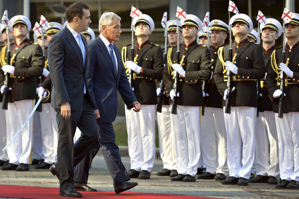 U.S. Defense Secretary Chuck Hagel is escorted past an honor cordon by Georgian Defense Minister Irakli Alasania during a ceremony welcoming Hagel to the defense ministry in Tbilisi, Georgia, September 7, 2014. Hagel is making his first visit to Georgia as defense secretary. (Department of Defense)