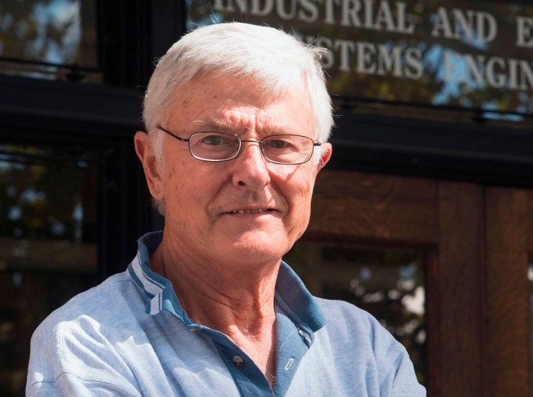 In this Sept. 12, 2013 photo, University of Illinois engineering Professor Lou Wozniak stands outside the office of Industrial and Enterprise Systems Engineering in Urbana. The university's Board of Trustees is meeting in Springfield Thursday, Nov. 14, 2013, and is scheduled to take up the decision of revoking the tenure of Wozniak for a list of charges. Wozniak has taught at the Champaign-Urbana campus for half a century. (AP Photo/MBR, John Dixon)