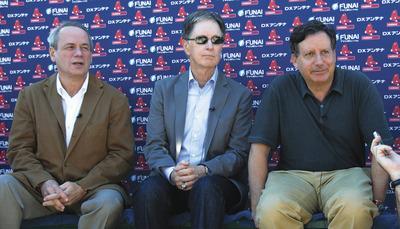 Dave Martin/AP
When Larry Lucchino, left, John Henry and Tom Werner(not shown)bought the Red Sox in 2002, it changed three teams'fates.