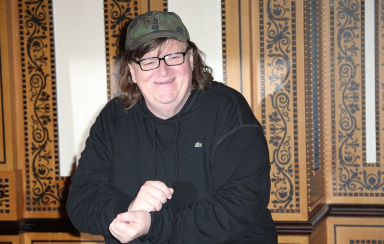 Filmmaker Michael Moore said the Democratic Party must be taken over in a populist revolution. (Photo by Joel Ryan/Invision/AP)