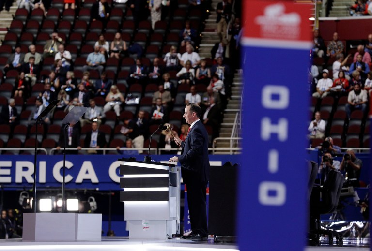 An RNC leader will announce from the podium the location of the Rules Committee meeting, where the committee will officially approve the rules crafted in last week's meetings. (AP Photo/John Locher)
