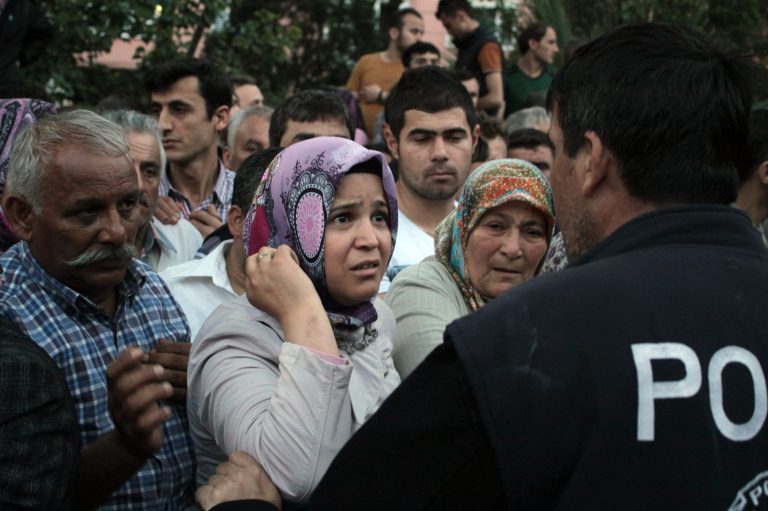 Relatives try to get information outside a local hospital after an explosion and fire at a coal mine in Soma, in western Turkey, Tuesday, May 13, 2014.  An explosion and fire at a coal mine in western Turkey killed at least one miner Tuesday and left up to 300 workers trapped underground, a Turkish official said. Twenty people were rescued from the mine in the town of Soma in Manisa province but one later died in the hospital, Soma administrator Mehmet Bahattin Atci told reporters. The town is 250 kilometers (155 miles) south of Istanbul. (AP Photo/Depo Photos)