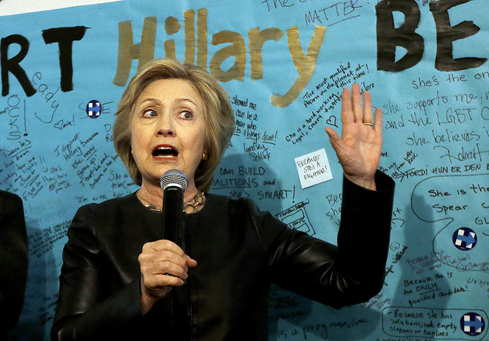 Clinton criticizes media coverage of Trump