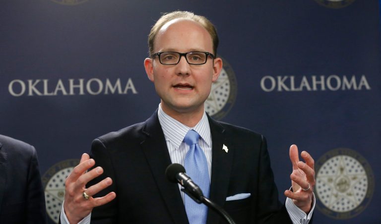 Oklahoma state Rep. Scott Inman gestures during a news conference in Oklahoma City, Monday, Feb. 3, 2014. (AP Photo/Sue Ogrocki)