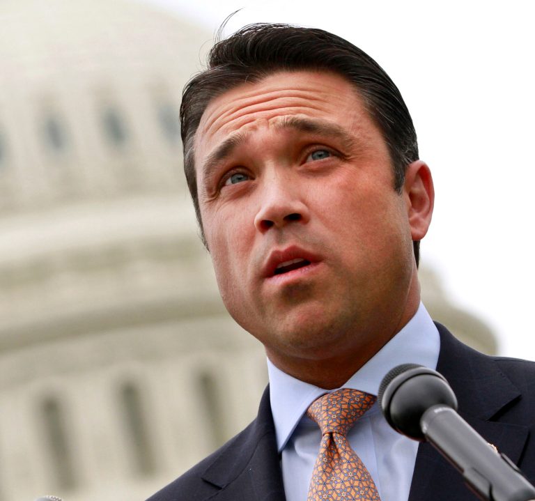 FILE- This May 9, 2012 file photo shows Rep. Michael Grimm, R-N.Y. speaking on Capitol Hill in Washington. Grimm is defending his actions after he physically threatened a reporter at the Capitol after President Barack Obama's State of the Union address Tuesday Jan. 28, 2014. After cutting the interview short, Grimm told New York cable news station NY1's Michael Scotto, 