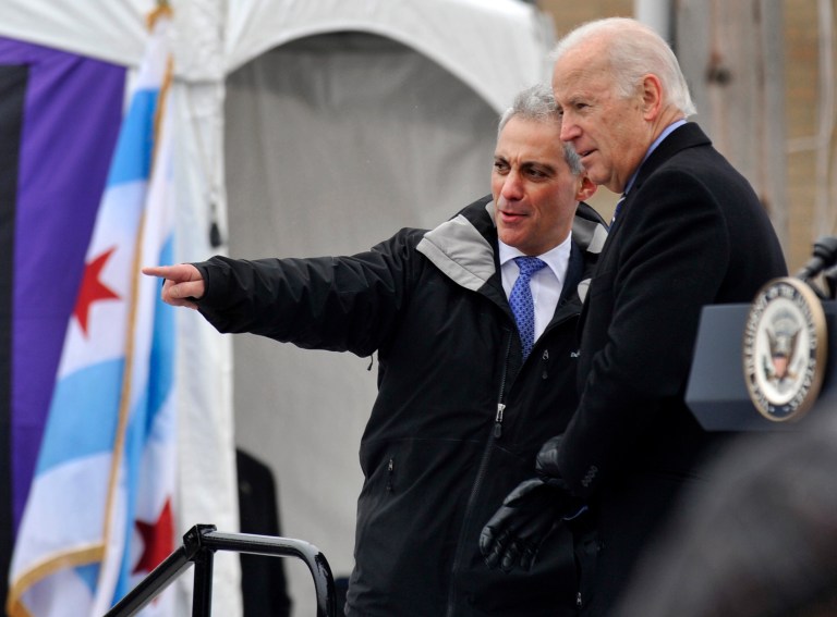 Vice President Joe Biden right, looks on as Chicago Mayor Rahm Emanuel points to the crowd after a ceremony celebrating the beginning of construction of the first domestic violence shelter in more than a decade in Chicago, Monday, Nov. 25, 2013. (AP Photo/Paul Beaty)