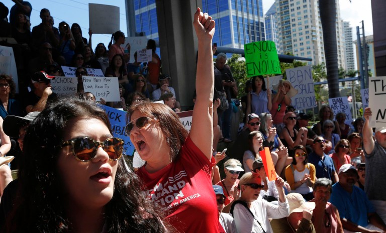 Helena Moreno, center, yells during a protest against guns on the steps of the Broward County Federal courthouse in Fort Lauderdale, Fla., on Saturday. (AP Photo/Brynn Anderson)