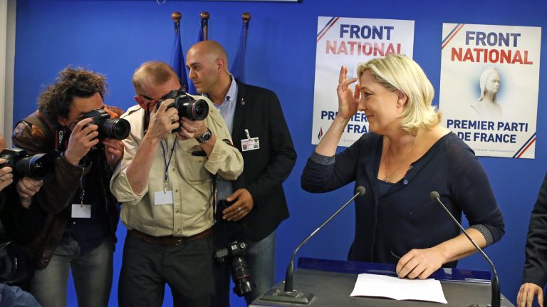 Far right party National Front leader Marine Le Pen poses for photographers before addressing reporters at the party's headquarters in Nanterre, west of Paris, Sunday May 25, 2014, following the victory of her party in the European Elections. (AP Photo / Remy de la Mauviniere)