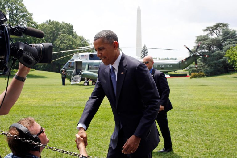 President Barack Obama wishes cameramen and sound engineers a Happy Father's Day after he spoke on the South Lawn about his administration's response to a growing insurgency foothold in Iraq, Friday, June 13, 2014, at the White House in Washington, prior to boarding the Marine One Helicopter for Andrews Air Force Base, Md., then onto North Dakota and California. (AP Photo/Charles Dharapak)