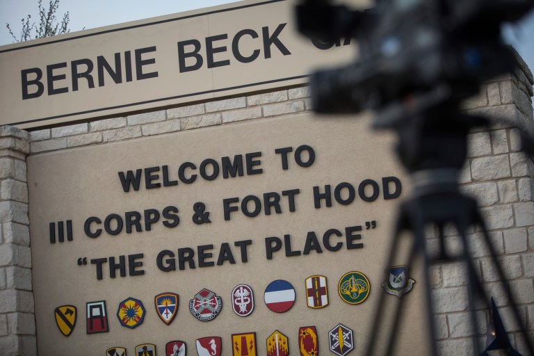 Members of the media wait outside of the Bernie Beck Gate, an entrance to the Fort Hood military base, for updates on a shooting that occurred inside on April 2 in Fort Hood, Texas. (AP/Tamir Kalifa)
