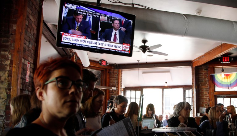 People from around the country stop by Washington, D.C., bars to watch Comey testify. (AP Photo/Manuel Balce Ceneta)
