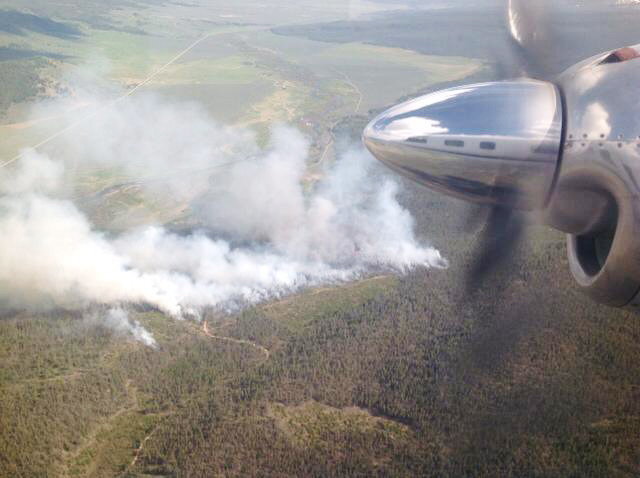 This photo provided by the U.S. Forest Service, shows smoke from a 60-acre wildfire burning in a popular tourist area about 10 miles south of Stanley in central Idaho. The mountainous area is heavily traveled by tourists starting this time of year, U.S. Forest Service spokeswoman Julie Thomas said. It's in the Sawtooth National Recreation Area, which draws hikers, rafters, rock climbers, anglers, mountain bikers and other outdoor enthusiasts.  (AP Photo/U.S. Forest Service)