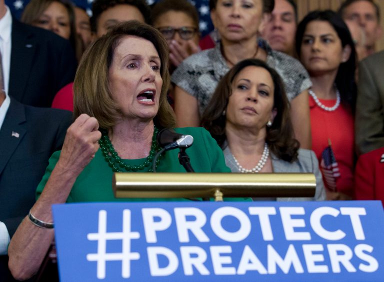 House Minority Leader Nancy Pelosi of Calif. accompanied by members of the House and Senate Democrats, gestures during a news conference on Capitol Hill in Washington, Wednesday, Sept. 6, 2017. House and Senate Democrats gather to call for Congressional Republicans to stand up to President Trump's decision to terminate the Deferred Action for Childhood Arrivals (DACA) initiative. ( AP Photo/Jose Luis Magana)