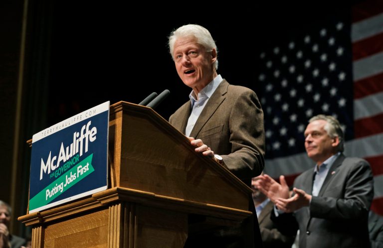 Former President Bill Clinton stumps for then-gubernatorial candidate and now Virginia Gov. Terry McAuliffe in Charlottesville, Va., on Oct. 30. (AP Photo/Steve Helber)
