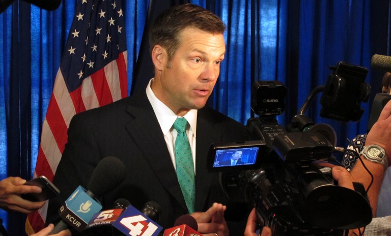 The Lawyers' Committee for Civil Rights Under Law asked the DOJ to investigate whether Kobach violated the Hatch Act. (AP Photo/John Hanna)