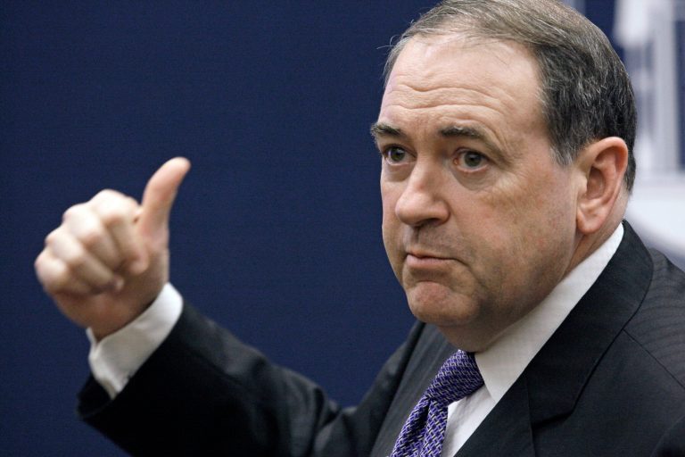In this March 28, 2011 file photo, former Arkansas Gov. Mike Huckabee gestures as he addresses students at the business school at Mississippi College in Clinton, Miss. (AP Photo/Rogelio V. Solis)