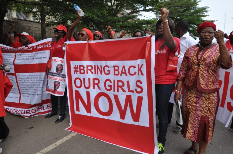 People attend a demonstration calling on the government to rescue the kidnapped girls of the government secondary school in Chibok, in Abuja, Nigeria. Scores of protesters marched chanting 