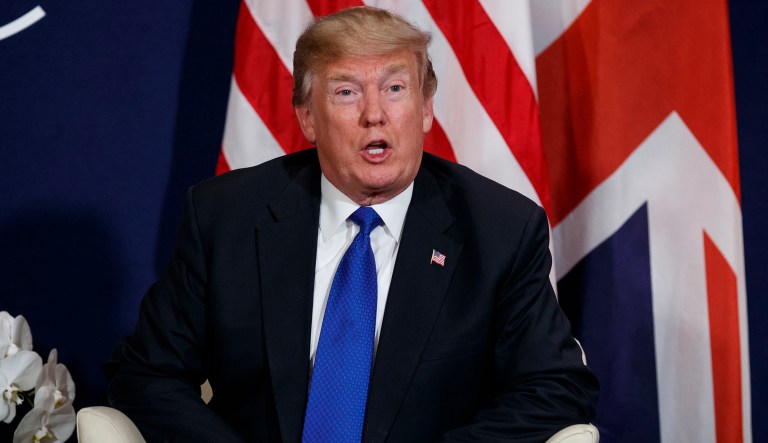 President Trump listens apologized for retweeting a video from a far-right British activist. 