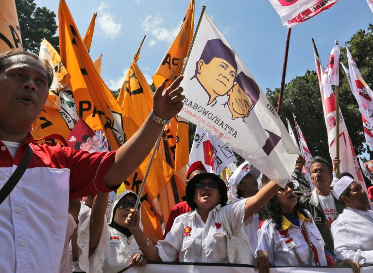 Supporters of Indonesian losing presidential candidate Prabowo Subianto shout slogans during a protest outside the Constitutional Court in Jakarta, Indonesia, Wednesday, Aug. 6, 2014. Indonesia's Constitutional Court on Wednesday began hearing a challenge to the result of the country's July 9 presidential election, which ended in victory for Jakarta Gov. Joko Widodo. (AP Photo/Tatan Syuflana)