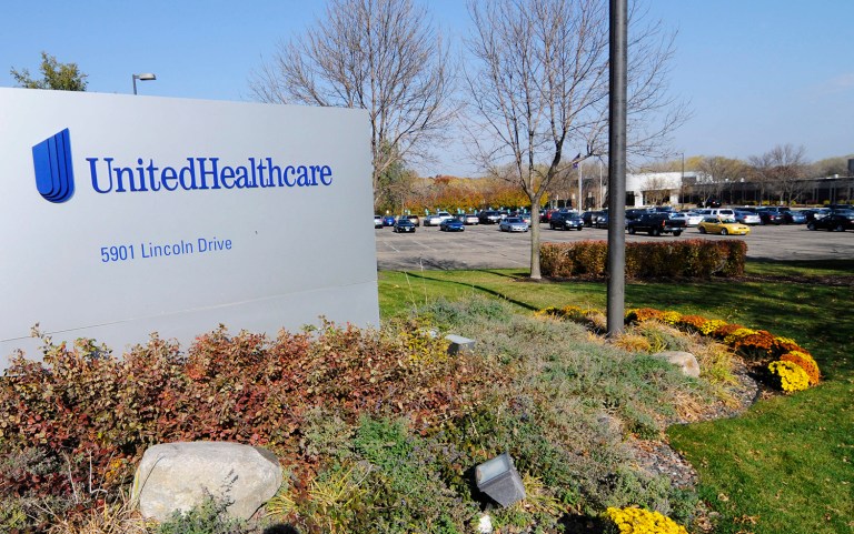 UnitedHealth Group's first-quarter revenues exceeded forecasts after the company scaled back its participation in the Obamacare exchanges, according to the company's earnings report. (AP Photo/Jim Mone)