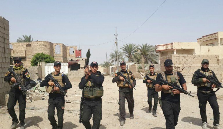 Iraqi anti-terrorism forces patrol in central Ramadi, Iraq, Saturday, April 18, 2015. After weeks of intense clashes, the city finally fell to the Islamic State. (AP Photo)