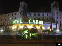 People walk past Hotel El Caribe in Cartagena, Colombia, one of several sites linked to a prostitution scandal involving U.S. Secret Service and Drug Enforcement Agency employees in April 2012 just before President Obama visited the country  for the Summit of the Americas conference. (AP Photo/Pedro Mendoza)