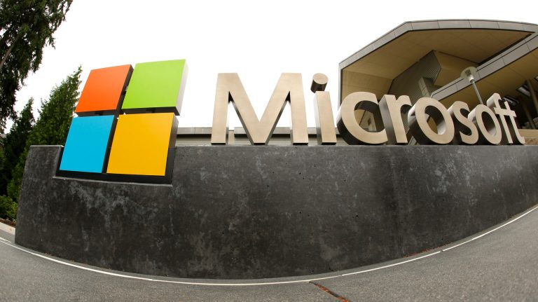 This photo taken July 3, 2014 shows the Microsoft Corp. logo outside the Microsoft Visitor Center in Redmond, Wash. Microsoft reports quarterly earnings on Tuesday, July 22, 2014. (AP Photo Ted S. Warren)