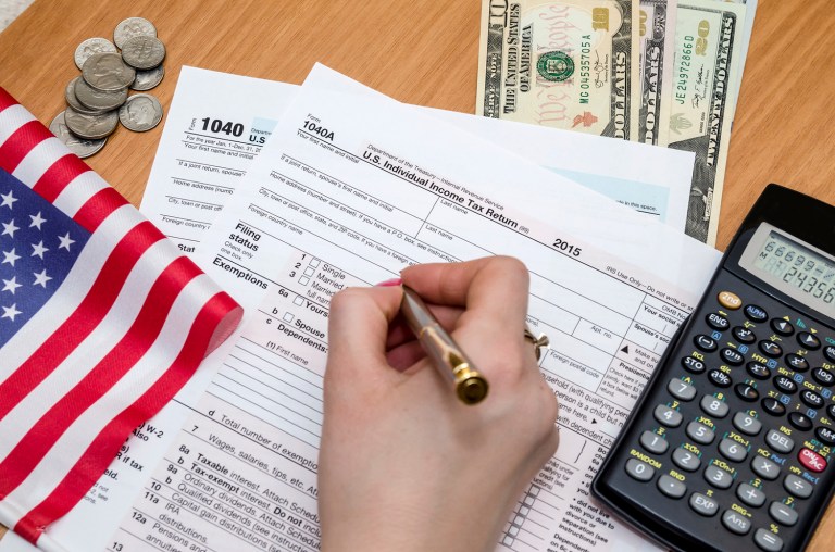 Americans will spend more than 8.9 billion hours complying with IRS paperwork, according to an analysis. That comes out to roughly 27.5 hours per American. (iStock Photo)