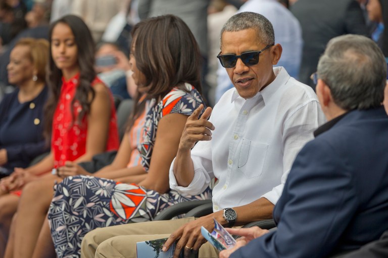 President Obama talks with Cuban President Raul Castro as they attend an exhibition baseball game in Havana, Cuba. (AP Photo/Pablo Martinez Monsivais)