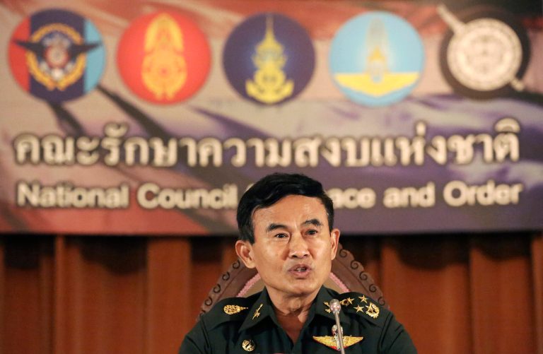 Secretary-General of the National Council for Peace and Order (NCPO) Gen. Paiboon Koomchaya, who also in charge of legal and justice affairs, speaks during a news conference at the Government House in Bangkok, Thailand, Wednesday, July 23, 2014. Thailand adopted a temporary constitution on Tuesday, taking its first step toward the slow return of electoral democracy after two months of military rule. But the charter's clauses allow the ruling junta to continue to hold substantial power even after an interim Cabinet and legislature take office. (AP Photo/Apichart Weerawong)