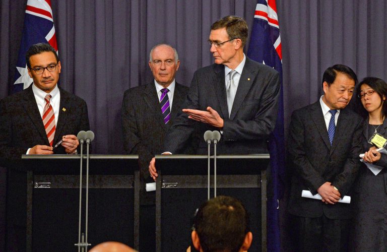 Australia's Transport Minister Warren Truss, second from left, Malaysia's acting Transport Minister Hishammuddin Hussein, left, and China's Transport Minister Yang Chuantang, second from right, attend a press conference for the nearly two-month-old hunt for the missing Malaysian jet with search coordinator Angus Houston, center, in Canberra, Australia, Monday, May 5, 2014. Senior officials from Malaysia, Australia and China are meeting in the Australian capital to hash out the details of the next steps in the search for Malaysia Airlines Flight 370, which will center around an expanded patch of seafloor in a remote area of the Indian Ocean off Western Australia. (AP Photo/AAP Image, Alan Porritt) NO ARCHIVING, NO SALES, AUSTRALIA OUT, NEW ZEALAND OUT, PAPUA NEW GUINEA OUT, SOUTH PACIFIC OUT