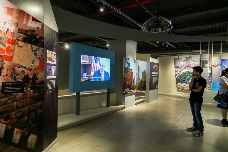 Visitors check out an exhibit at the 9/11 Tribute Museum. The museum, open since 2006, closed its doors permanently on Aug. 31 due to financial hardships.