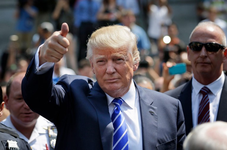 After taking the oath of office, President Trump will get to work rounding out the judicial roster by filling more than a hundred vacancies on benches around the country. (AP Photo/Seth Wenig)