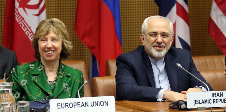 European foreign policy chief Catherine Ashton, left, and Iranian Foreign Minister Mohamad Javad Zarif, right, wait for the start of closed-door nuclear talks in Vienna, Austria, Tuesday, April 8, 2014. Iran and six world powers are hoping to narrow differences at a new round of nuclear talks, less than three months before an informal July deadline for a deal. (AP Photo/Ronald Zak)