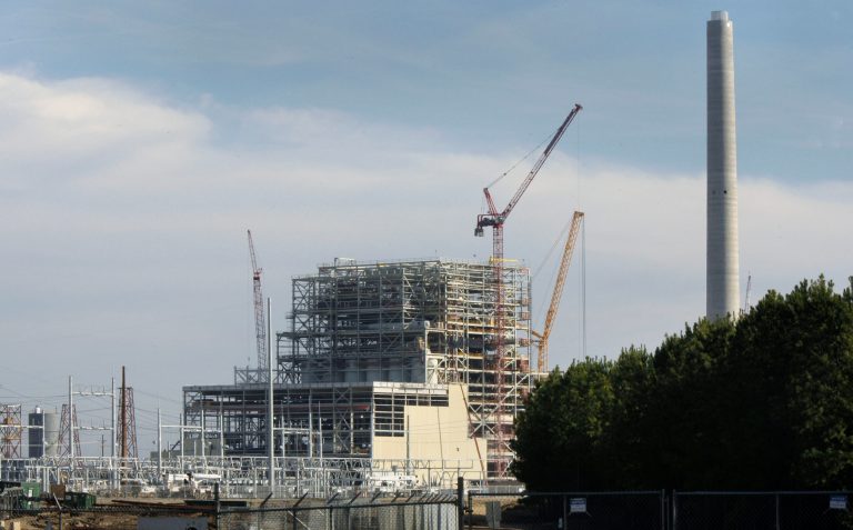 In this file photo taken Feb. 14, 2011, construction progresses on the John W. Turk, Jr., power plant near Fulton, Ark. Environmental groups and an electric utility agreed Thursday, Dec. 22, 2011 to settle their litigation over the $2.1 billion coal-fired electric generation plant still under construction. (AP Photo/Danny Johnston, File)