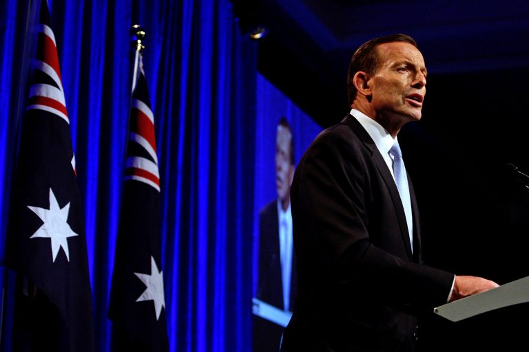 Australian opposition leader Tony Abbott speaks to supporters in Sydney, Saturday, Sept. 7, 2013, following his win in Australia's national election. Australia's conservative opposition swept to power, ending six years of Labor Party rule and winning over a disenchanted public by promising to end a hated tax on carbon emissions, boost a flagging economy and bring about political stability after years of Labor infighting. (AP Photo/Lisa Maree Williams, Pool)