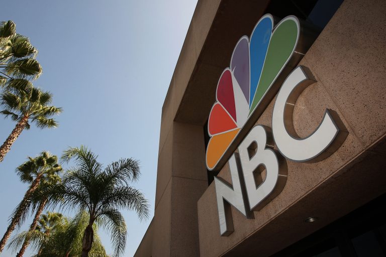 The NBC peacock logo hangs on the NBC studios building on October 20, 2008 in Burbank, California.