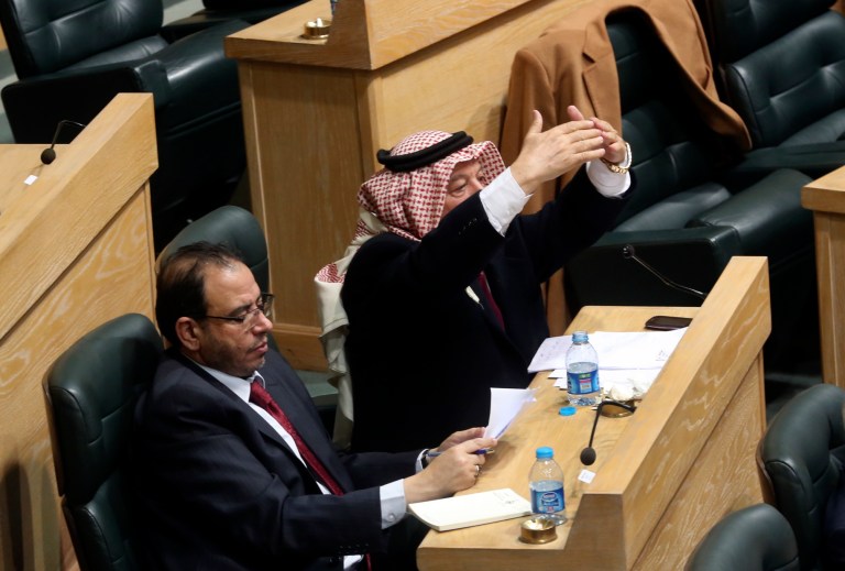 Jordanian lawmakers attend the second day of a heated debate on the U.S. push for a peace deal between Israelis and Palestinians, under the domed parliament chamber in the capital, Amman, Jordan, Tuesday, Feb. 4, 2014. The kingdom is already home to the largest Palestinian population outside the West Bank and Gaza Strip, and Jordanian lawmakers and others fear the Palestinians will be coerced into an accord that gives up land and leads to a new influx of refugees into Jordan.  (AP Photo)
