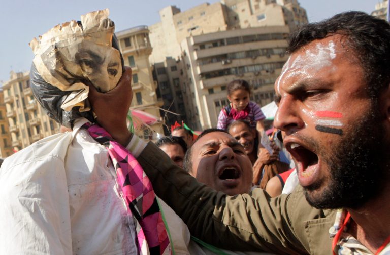   An Egyptian protester prepares to hang an effigy representing ousted president Hosni Mubarak at Tahrir Square, Cairo, Egypt, Friday, June 8, 2012. Hundreds gathered in Cairo's Tahrir Square, the focal point of Egyptian uprising, to demonstrate against presidential candidate Ahmed Shafiq, Hosni Mubarak's last prime minister, ahead of a run-off vote.(AP Photo/Amr Nabil)  