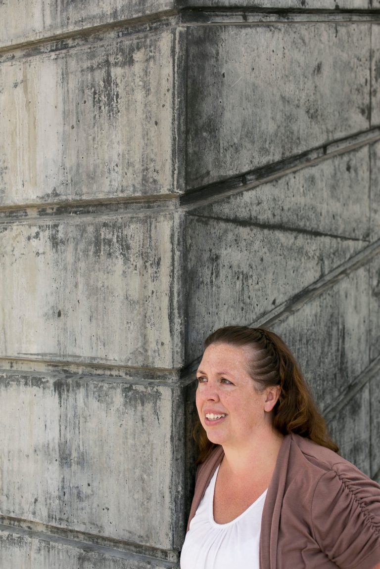 In this photo taken Tuesday, Apr. 23, 2013, Dannette Lopez poses for a photo in Pasadena, Calif. Lopez lost her father in the Sept. 11 attacks, but she did not find out about scholarship money available through the sale of the specialty memorial license plates until after the 2005 deadline. A state audit has found that officials failed to tell all the Californians who lost parents or spouses in the 2001 terror attacks about a scholarship program funded by fees from a specialty memorial license plate. Only four of the more than 40 families eligible ever claimed the scholarships. Some children and parents are now hoping the state will reopen the program, which closed in 2007, after the audit confirmed an AP investigation that the money was mishandled. (AP Photo/Damian Dovarganes)