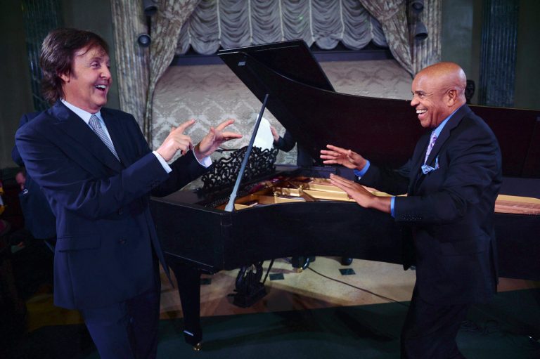 FILE - In this Sept. 18, 2012 file photo provided by the Motown Museum, Paul McCartney, left, and Berry Gordy stand in front of a newly restored 1877 Steinway grand piano during a benefit at the Motown Museum at Steinway Hall in New York. The piano, used by Motown greats during the label's heyday, was restored with an assist by McCartney. In an April 1, 2013 news release from the museum, it was announced that the famed 9-foot piano has been returned to Detroit and will go back on display at the Motown museum's famed Studio A in the 