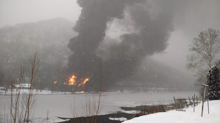 In this Monday, Feb. 16, 2015 photo provided by WCHS-TV, fire burns at the scene of a train derailment, near Mount Carbon, W.Va. Fires burned for nearly nine hours after the train carrying more than 100 tankers of crude oil derailed in a snowstorm, plunging at least one tanker into a river while sending a fireball into the sky, authorities and residents say. (AP Photo/WCHS-TV, Bob Aaron)